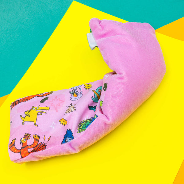 A pink eye mask on with Katie Abey Happiness Enchanters characters on including unicorns, mermaids and dragons