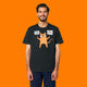 Front view of a model wearing the Katie Abey Grateful To Be Here But Respectfully WTF adults t shirt in black. The design features a quirky orange cartoon cat holding two signs reading “Grateful To Be Here” and “But Respectfully… WTF”. Humorous alternative graphic tee illustrated by Katie Abey.
