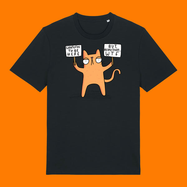 Front view of the Katie Abey Grateful To Be Here But Respectfully WTF adults t shirt in black. Features a whimsical cartoon cat illustration holding protest signs with humorous wording. Alternative graphic tee by illustrator Katie Abey on an orange background.