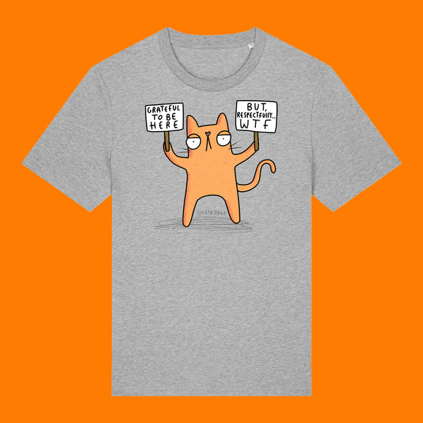 Front view of the Katie Abey Grateful To Be Here But Respectfully WTF adults t shirt in heather grey. Features a quirky orange cartoon cat holding two signs reading “Grateful To Be Here” and “But Respectfully… WTF”, illustrated by Katie Abey. Funny alternative graphic tee on an orange background.
