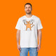 Front view of a model wearing the Katie Abey Grateful To Be Here But Respectfully WTF adults graphic t shirt in white. The design features a quirky orange cartoon cat holding two signs reading “Grateful To Be Here” and “But Respectfully… WTF”. Humorous alternative graphic tee illustrated by Katie Abey.