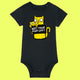 Black organic cotton baby grow featuring a bold yellow cartoon cat illustration holding a “Not Today Mum Guilt” sign. Designed by UK illustrator Katie Abey, this funny and relatable baby outfit makes a perfect gift for new parents who enjoy humour and quirky design.