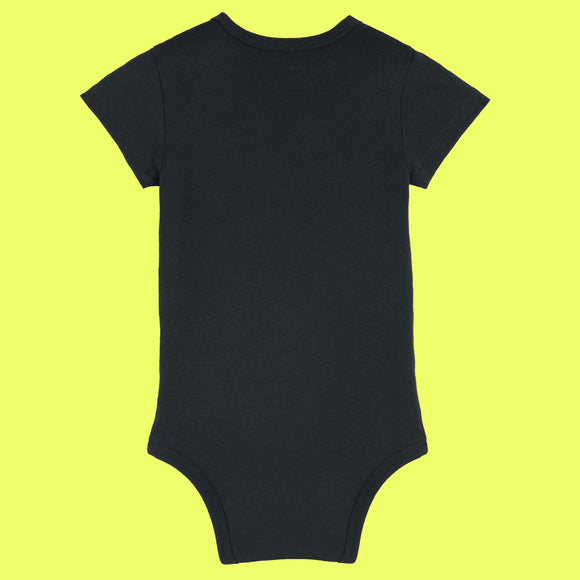 Back view of black organic cotton baby grow with short sleeves, envelope neckline and popper fastening. Simple back design of the “Not Today Mum Guilt” babygrow by UK illustrator Katie Abey, an independent UK illustrator known for quirky and uplifting artwork.