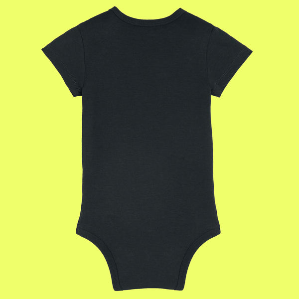 Back view of black organic cotton baby grow with short sleeves, envelope neckline and popper fastening. Simple back design of the “Not Today Mum Guilt” babygrow by UK illustrator Katie Abey, an independent UK illustrator known for quirky and uplifting artwork.