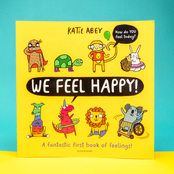 A yellow children's book with fun characters by Katie Abey with text saying We feel Happy and A fantastic first book of feelings! 
