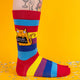 Straight-on view of both socks, showing the full rainbow stripe pattern and the “I F*cking Hate People” cat graphic. Fun and cheeky fashion for your feet.