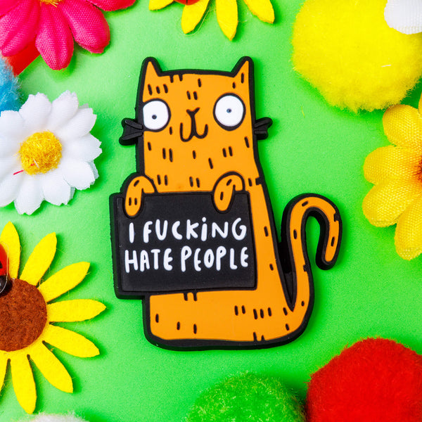 Sweary cats recycled rubber rainbow fridge magnet. Colourful orange smiley cat with black outline. Designed in the UK by Katie Abey