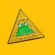 Close-up of the Katie Abey 'Leap of Faith' enamel pin featuring a quirky green frog on a yellow glittery triangle background. The words 'Taking a Leap of Faith' are written around the frog.