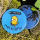Mocktopus the Octopus pocket mirror, featuring illustrated yellow smiley octopus with speech bubble reading 'Ha! Your Face'. Designed in the UK by Katie Abey