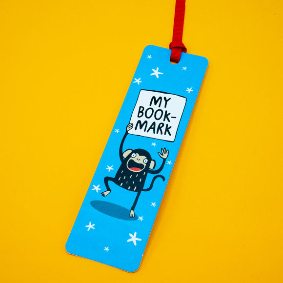 Angled view of Katie Abey Monkey Bookmark with red ribbon on yellow background. Features cheerful cartoon monkey design and bold “My Bookmark” text. Unique illustrated bookmark for readers who love quirky gifts.