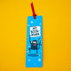 Full view of My Bookmark Monkey bookmark by Katie Abey with red ribbon. Playful monkey illustration on blue starry background holding “My Bookmark” sign. Bright, fun bookmark perfect for book lovers and gifting.