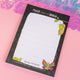 Top view of the Katie Abey notepad with metamorphosis-themed illustrations, ideal for capturing your thoughts and embracing change. Features the text “Mush from my Brain.”
