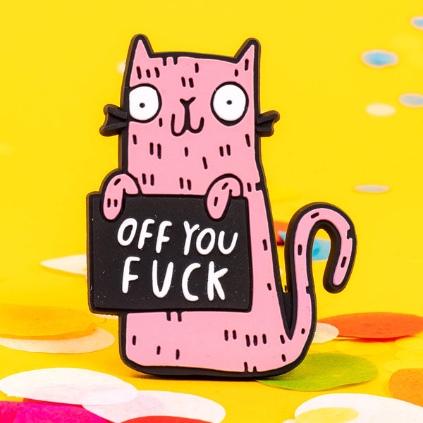 Funny sweary pink cat fridge magnet holding a black sign which reads 'off you...'. Designed by Katie Abey in the UK