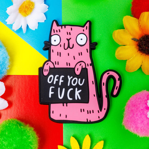 Funny sweary pink cat fridge magnet holding a black sign which reads 'off you...'. Designed by Katie Abey in the UK
