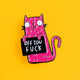 Close-up of a Katie Abey soft enamel pin, showcasing a whimsical pink cat with a mischievous expression, holding a sign that reads 'Off You Fuck'. The cat stands out against a bright yellow background