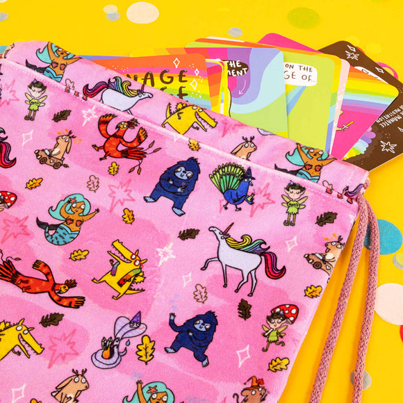 happy enchanted oracle bag in pink with lots of cute Katie Abey illustrations on a yellow background with confetti