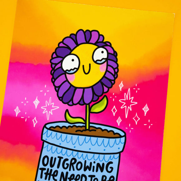 Detail of Katie Abey’s Outgrowing The Need To Be Understood flower print. Illustrated happy purple flower with yellow face in a plant pot, surrounded by doodle stars. Bright pink and orange backdrop, matte A4 wall art, signed and numbered, only 10 available.