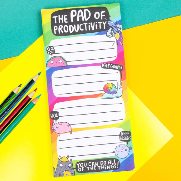the pad of productivity by Katie Abey is a thin pad of paper with fun characters and says you can do all the things on it. It is on a bring colourful base