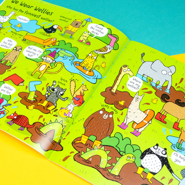Look inside the We Wear Pants Book by Katie Abey showing lots of fun characters at a park on a rainy day wearing various wellies. it is vibrant and full of fun