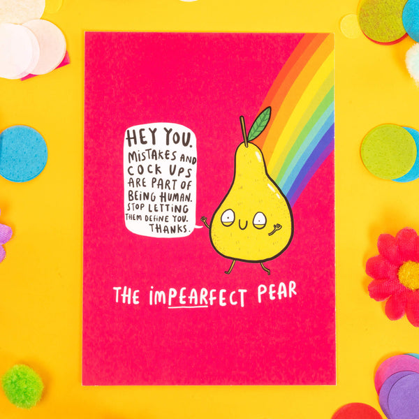 un cute A6 silk finish greeting postcard, featuring illustrated happy pear holding its arms in the air saying "Hey you, mistakes and cock ups are part of being human. Stop letting them define you. Thanks. It has the impearfect pear underneath and is on pink background with a rainbow. Designed by Katie Abey in the UK.