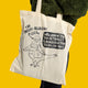 Passive Aggressive Pigeon Tote Bag by Katie Abey shown in full, natural cotton canvas with black illustration and sarcastic slogan. Features a cartoon pigeon holding a tote bag, perfect eco-friendly reusable shopping bag with a playful, alternative design from a UK small business.