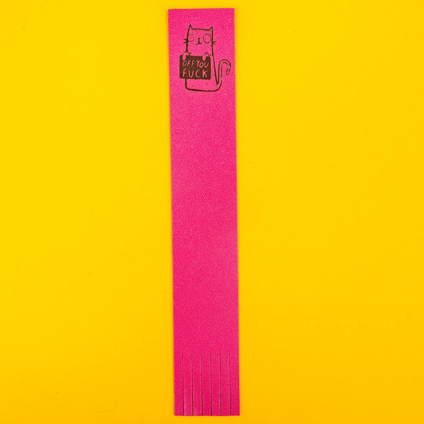 a pink bookmark with an embossed cat on the top illustrated by Katie Abey holding a sign saying off you fuck