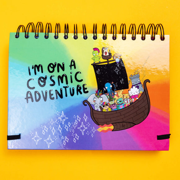 back cover of the planner showing a ship with lots of fun characters and text saying I'm on a cosmic adventure
