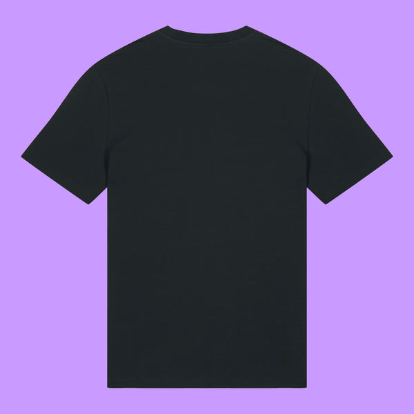 Back view of a black organic cotton unisex adults t-shirt by Katie Abey displayed on a purple background. Plain back of the Prioritising Whimsy, Nonsense and Joy graphic tee showing the relaxed fit and soft fabric.
