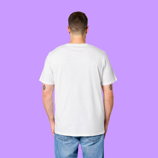 Back view of a white Katie Abey Prioritising Whimsy, Nonsense and Joy adults tee worn by a model with visible arm tattoos. The unisex organic cotton t-shirt shows the plain back and relaxed fit against a purple background.