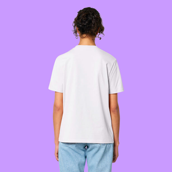 Back view of a white Katie Abey Prioritising Whimsy, Nonsense and Joy adults t-shirt worn by a model against a purple background. The organic cotton unisex tee has a relaxed everyday fit and plain back.
