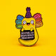 A colourful enamel pin badge by Katie Abey featuring a bright yellow axolotl with rainbow gills and a party hat, holding a sign that says Normalise Being Really Abnormal. Displayed on a vibrant yellow background. A fun, quirky accessory encouraging individuality and embracing your inner weirdo.