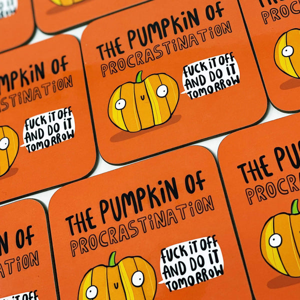Fun Pumpkin of Procrastination art printed coaster, pumpkin with smiley face on tea coffee coaster with orange background. Designed by Katie Abey in the UK