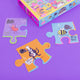 The unusual alphabet giant floor puzzle box by Katie Abey with fun characters on a purple background