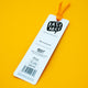 Back of Katie Abey Well Read Panda Red Panda Bookmark with orange ribbon on bright yellow background, showing branding, barcode and recycled paper details. Cute illustrated bookmark by quirky UK artist encouraging self expression and reading.