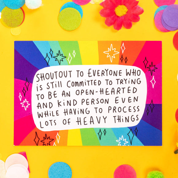 a postcard with rainbow around the edges with Katie Abeys handwriting in the middle saying 'shoutout to everyone who is still committed to trying to be an open-hearted and kind person even while having to process lots of heavy things.'