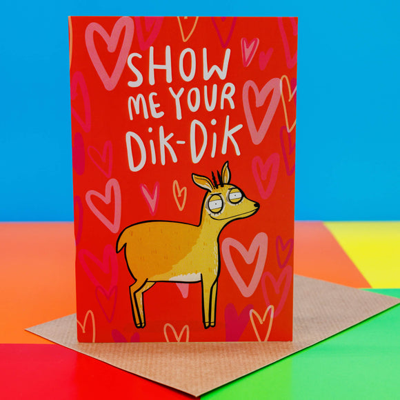 A red card with a dik dik with red hearts behind it saying show me your Dik-Dik. It is sat on its envelope on a primary coloured background.