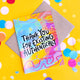 Greeting card with a rainbow coloured background with 'thank you for existing authentically' written on the front in black letters.