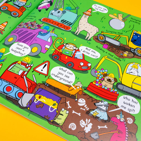 We catch the bus by Katie Abey book being held open. The page spread features various animals in fun cars on a red background. Super bright colours and fun anecdotes. Printed in the UK by bloomsbury.