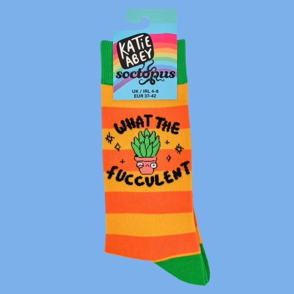 A close-up of Katie Abey's "What the Fucculent?" socks, showcasing the playful succulent design with bright orange, yellow, and green stripes. Perfect for plant lovers or fans of quirky fashion, these socks scream weirdly wonderful.