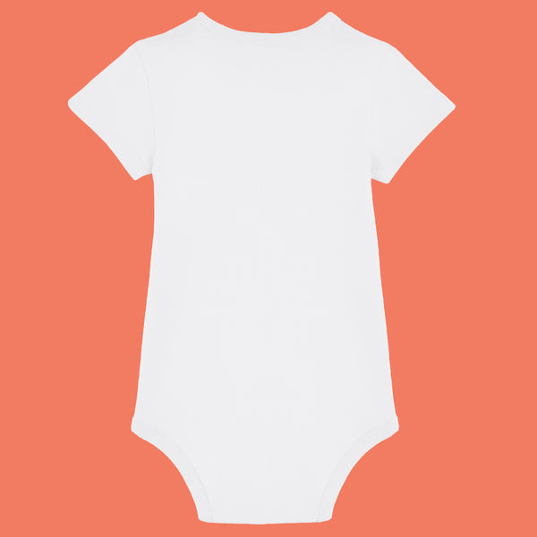 White organic cotton baby bodysuit by Katie Abey shown from the back. Minimal short sleeve babygrow made from soft ring spun combed cotton with popper fastening for easy nappy changes. Comfortable unisex baby clothing from a UK illustrator who celebrates individuality and weirdness.
