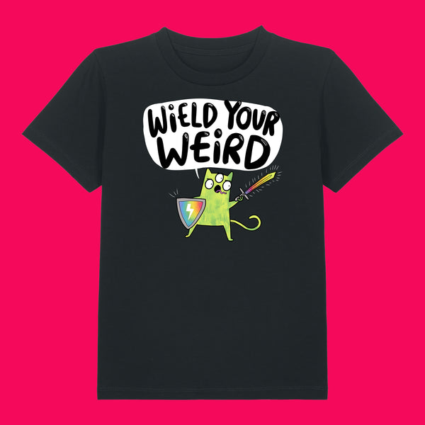 Black kids t shirt featuring Katie Abey Wield Your Weird artwork, showing a green cartoon character holding a rainbow shield and sword with bold speech bubble text. Organic cotton children’s tee on a bright pink background, fun quirky illustration encouraging kids to embrace being weird.