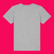 Back view of heather grey kids t shirt laid flat on a bright pink background. Plain back design showing soft organic cotton fabric, short sleeves and classic fit. Unisex children’s t shirt designed by Katie Abey for everyday comfort and wear.
