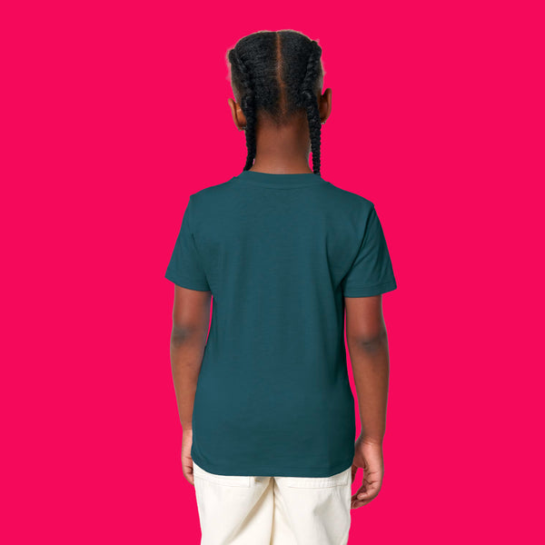 Back view of child wearing stargazer blue kids t shirt by Katie Abey. Plain back design with short sleeves and relaxed fit, photographed on a bright pink background. Soft organic cotton tee designed for comfort and play.