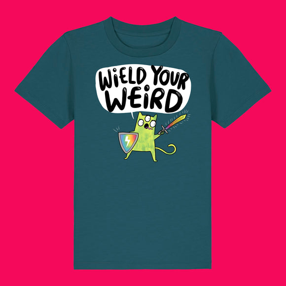 Stargazer blue kids t shirt featuring Katie Abey Wield Your Weird artwork with a green cartoon character, rainbow shield and sword. Organic cotton children’s tee on a bright pink background, bold colourful illustration celebrating creativity and individuality.