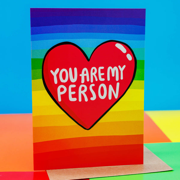 A Katie Abey A6 rainbow backed greeting card with a big red hear in the middle and the words inside 'You are my person' 