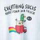 Everything Sucks Here's A Duck in a Truck black writing on a white cotton tshirt, featuring a waving green duck sitting in a red truck with rainbows illustration. Designed by Katie Abey in the UK.