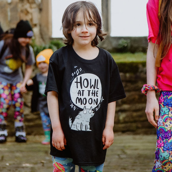 Howl at the Moon youth kids childrens black T-shirt with illustrated smiley wolf and moon. 100 % cotton. Designed by Katie Abey in the UK. 