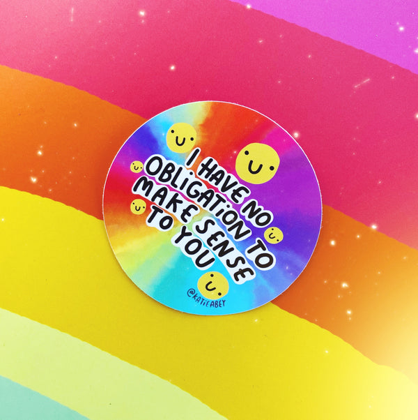 I have no obligation to make sense to you sticker, circular vinyl sticker with rainbow watercolour effect background featuring yellow smiley faces and black and white writing. Designed by Katie Abye in the UK