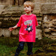 Monumental Magpie Pink Kids Tshirt 100% cotton tshirt with illustrated happy magpie design wearing crown with speech bubble and black writing that reads 'The Magnificent Magpie'. Designed in the UK by Katie Abey